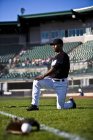 Professional african american baseball player at field — Stock Photo