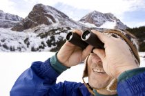 Man Looking Through Binoculars — Stock Photo