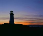 Leuchtturm bei Sonnenuntergang, Peggys Bucht — Stockfoto