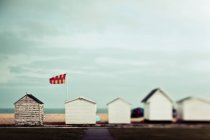 Whitewashed small houses standing in a row over field during daytime — Stock Photo