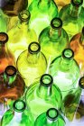 Primo piano di bottiglie di vetro colorato retroilluminato su sfondo bianco; Calgary, Alberta, Canada — Foto stock