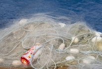 A Fishing Net Is Piled On A Dock; Astoria, Oregon, United States Of America — Stock Photo