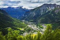 Aerial view of Courmayeur city surrounded by mountains; Courmayeur, Aosta Valley, Italy — Stock Photo