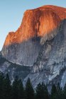 Half Dome sunset alpenglow, Yosemite National Park; California, United States of America — Stock Photo