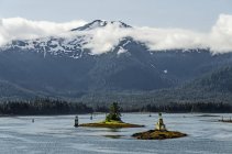View from Alaska State Ferry of Lower Wrangell Narrows toward Wrangell Island, numerous navagation markers visible, and Zarembo Island visible in background; Alaska, United States of America — Stock Photo