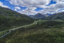 Dempster highway winding its way through the Tombstone Mountains; Yukon Territory, Canada — Stock Photo