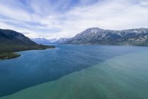 The colour difference of Bennett Lake which the town of Carcross sits along; Carcross, Yukon Territory, Canada — Stock Photo