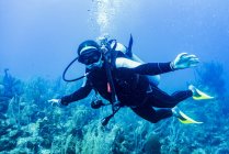 Portrait of young male scuba diver underwater — Stock Photo