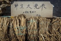 Roots for sale in a street market in Datong; China — Stock Photo
