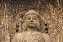 The Longmen Caves, some of the finest examples of Chinese Buddhist art, housing tens of thousands of statues of Buddha and his disciples; Luoyang, Henan Province, China — Stock Photo