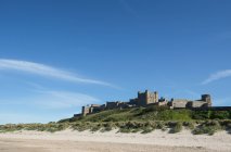 Scenic view of famous Bamburgh Castle from sea, Bamburgh, Northumberland, England — Stock Photo
