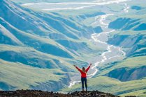 Woman exploring the rugged mountains of Kluane National Park and Reserve; Haines Junction, Yukon, Canada — Stock Photo