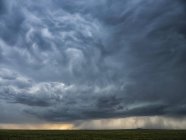 Dramatic sky over the landscape during storm in the middle west of the United States, Kansas, United States of America — стоковое фото
