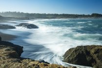 Waves softened by a long exposure surge onto the beach at MacKerricher State Park and Marine Conservation Area near Cleone in Northern California, Cleone, California, United States of America — Stock Photo