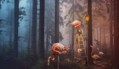 Una imagen compuesta surrealista de flamencos en un bosque con una escalera y poste de lámpara - foto de stock