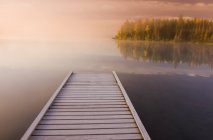 Frost covered dock at sunrise, Glad Lake, Duck Mountain Provincial Park; Manitoba, Canada — Stock Photo