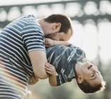 Father plays with his young son; Edmonton, Alberta, Canada — Stock Photo