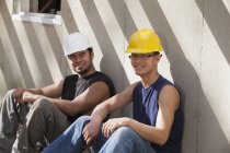 Hispanic carpenters taking a break at construction site — Stock Photo