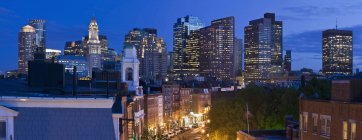 Buildings lit up at night in a city, Hanover Street, Boston, Massachusetts, USA — Stock Photo