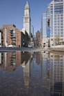 Custom House Tower reflected in a puddle at Rose Kennedy Greenway, Boston, Massachusetts, USA — Stock Photo