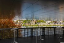 Viewing area with tall tables with a view of the cityscape and Reuss River; Lucerne, Lucerne, Switzerland — Stock Photo