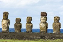 Five moais on their platform in morning light with the ocean in the background; Easter Island, Chile — Stock Photo