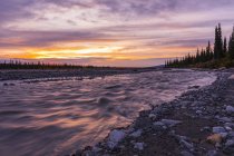 Sunset over the Muddy River in Denali National Park and Preserve; Alaska, United States of America — Stock Photo