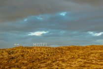 Motel sign and volcanic landscape, Reykjanes Peninsula; Iceland - foto de stock