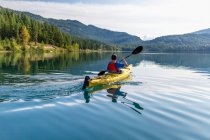Teenage boy kayaking on White Lake, White Lake Provincial Park; British Columbia, Canada — Stock Photo