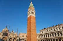 Campanile and St. Mark 's Basilica, St. Mark' s Square; Venice, Italy — стоковое фото