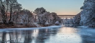 Carrickabrick railway viaduct in Fermoy, over a frozen Blackwater River, in winter surrounded by snow-covered countryside; Fermoy, County Cork, Ireland — Stock Photo