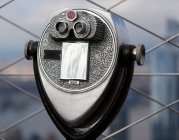 Binoculars outside on the observation deck at the Empire State Building in Midtown Manhattan; New York City, New York, United States of America — Stock Photo