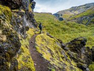 A woman walking at the Glymur hiking trail. Hvalfjardarsveit, Capital Region, Iceland — Stock Photo