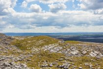 Edge of a hill overlooking Burren National Park on a sunny, summer day; County Clare, Irlanda — Fotografia de Stock