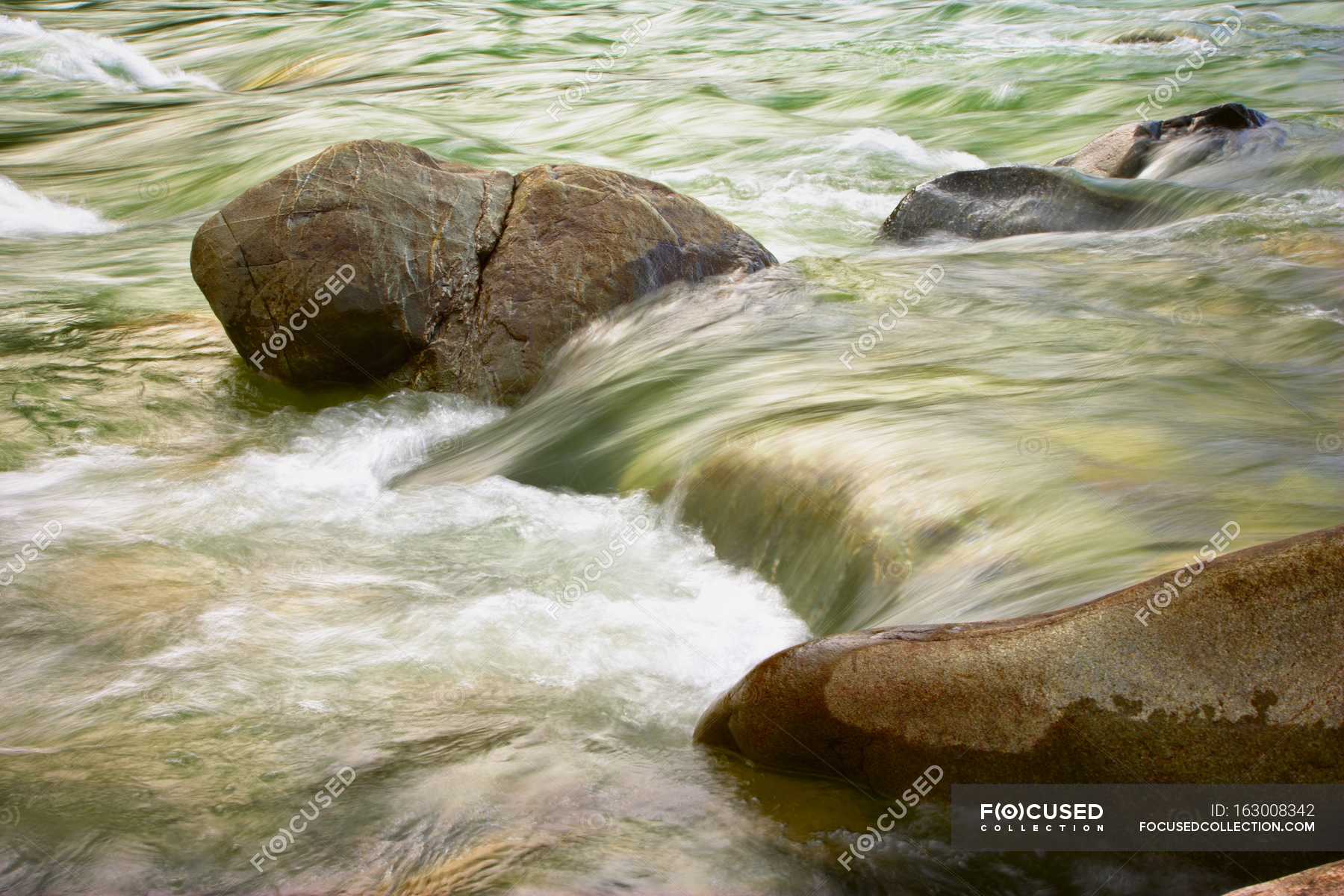 rushing-water-of-river-outdoors-environment-stock-photo-163008342