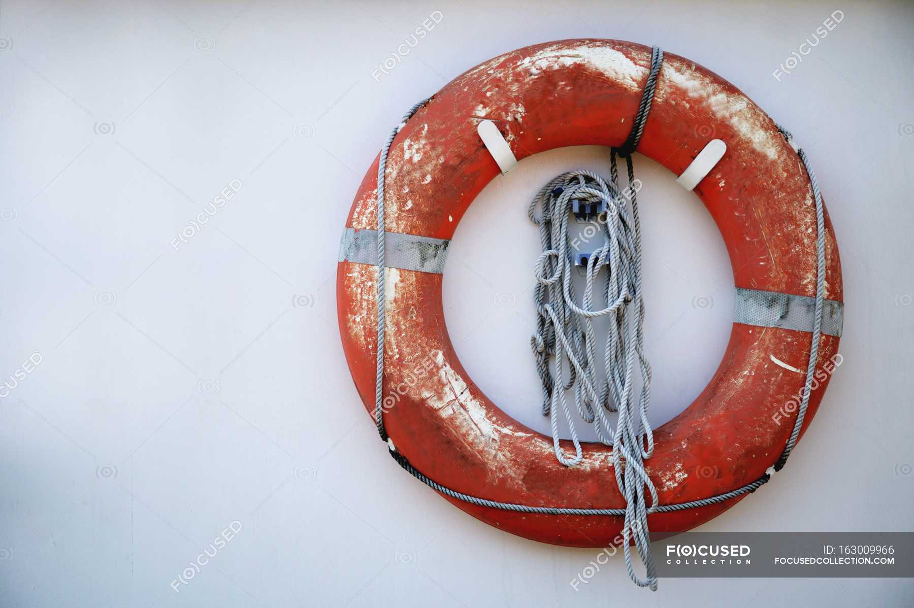 Life Saver on white wall — red, recreation - Stock Photo | #163009966