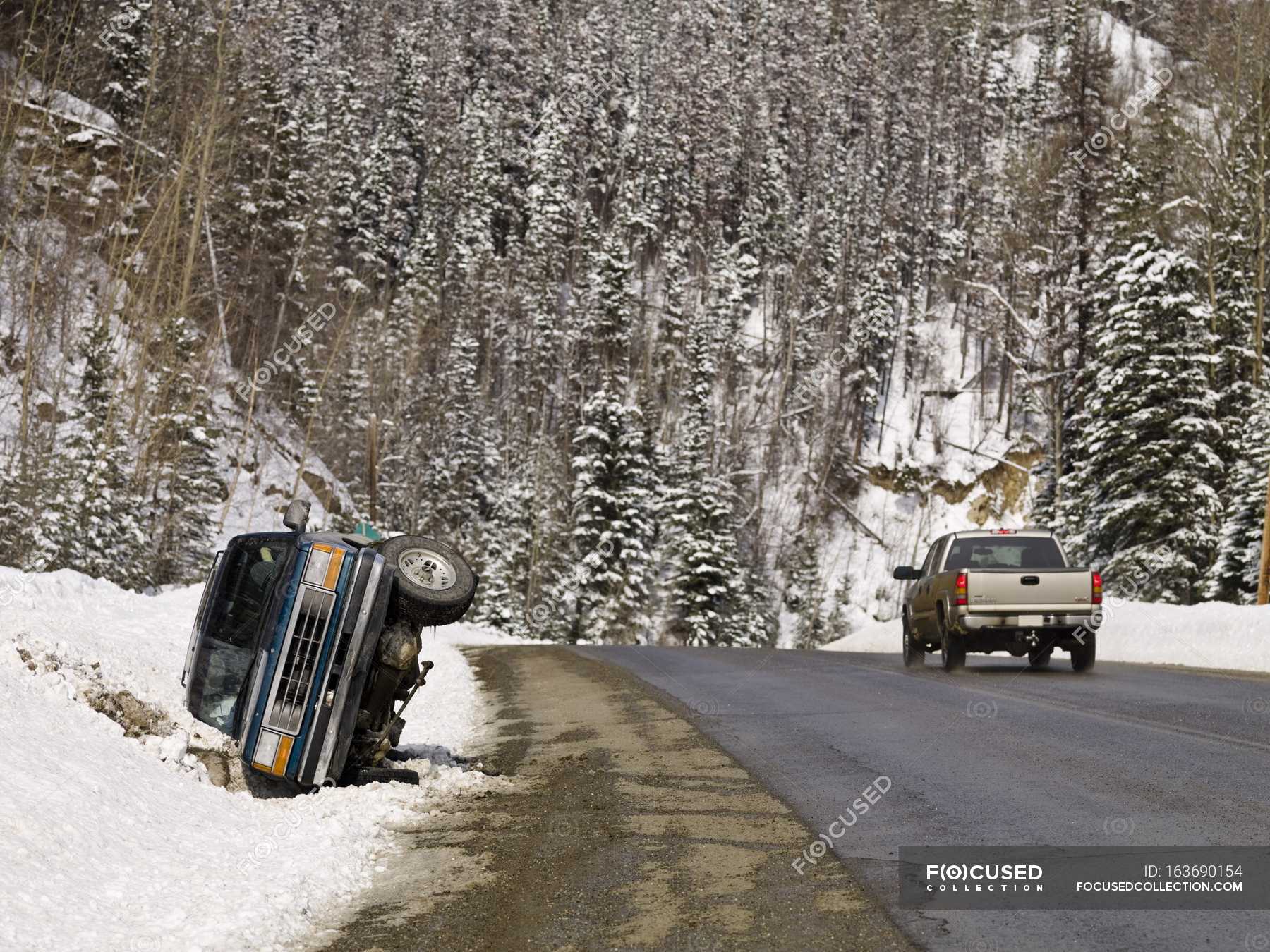 Car In Ditch on roadside — attraction, winter Stock Photo 163690154