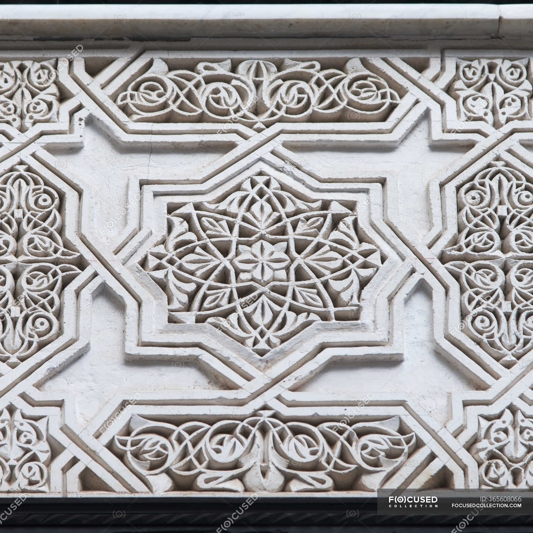 Carved ornate pattern — low angle, wall - Stock Photo | #165608066