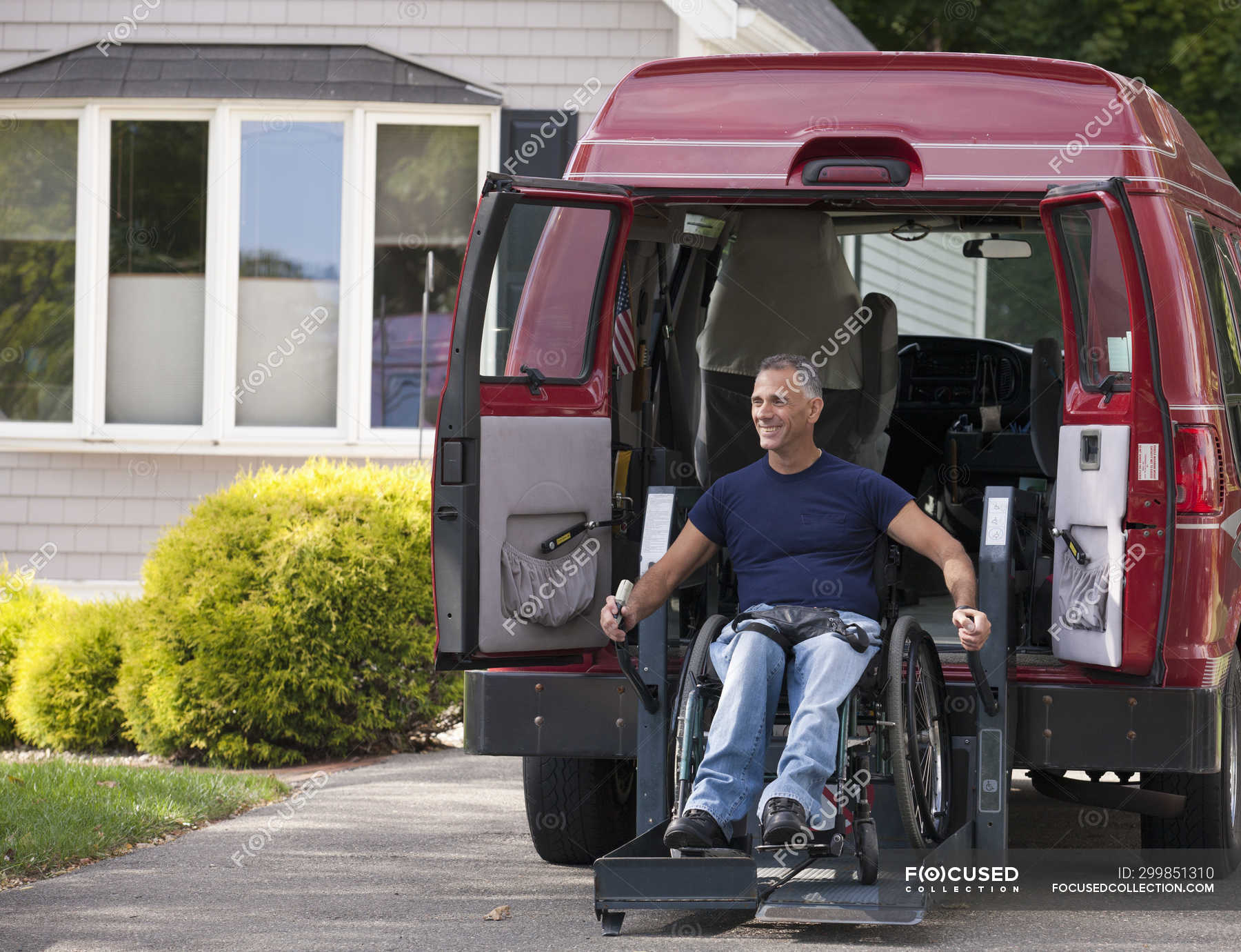 Man with spinal cord injury in a wheelchair getting in his accessible