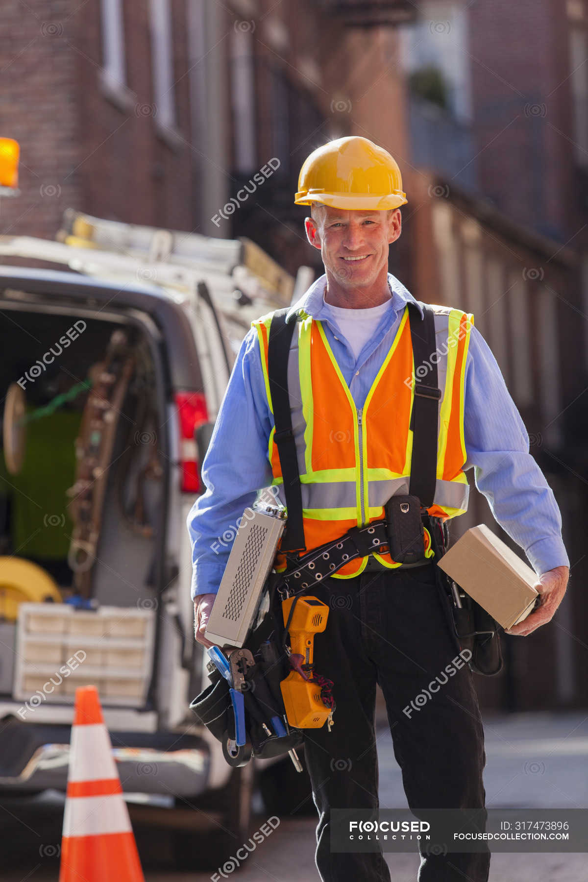 Cable installer with cable boxes from truck for installation — work