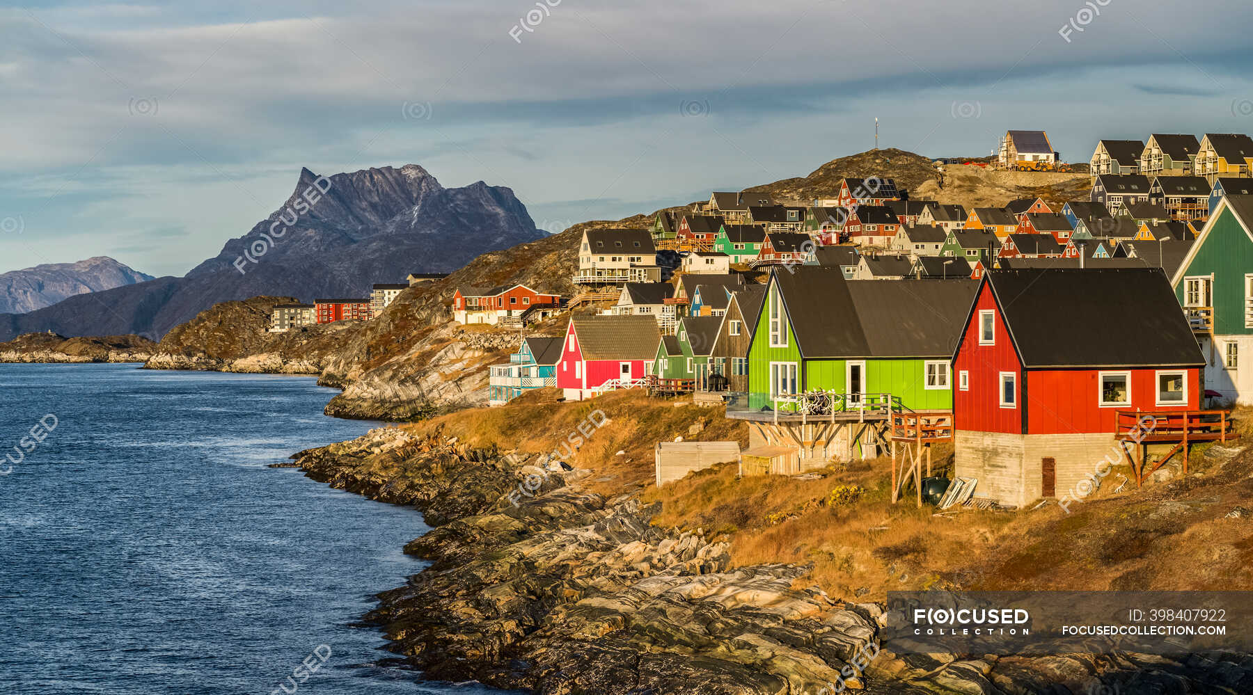 Colourful houses along the rocky shore of Nuuk; Nuuk, Sermersooq