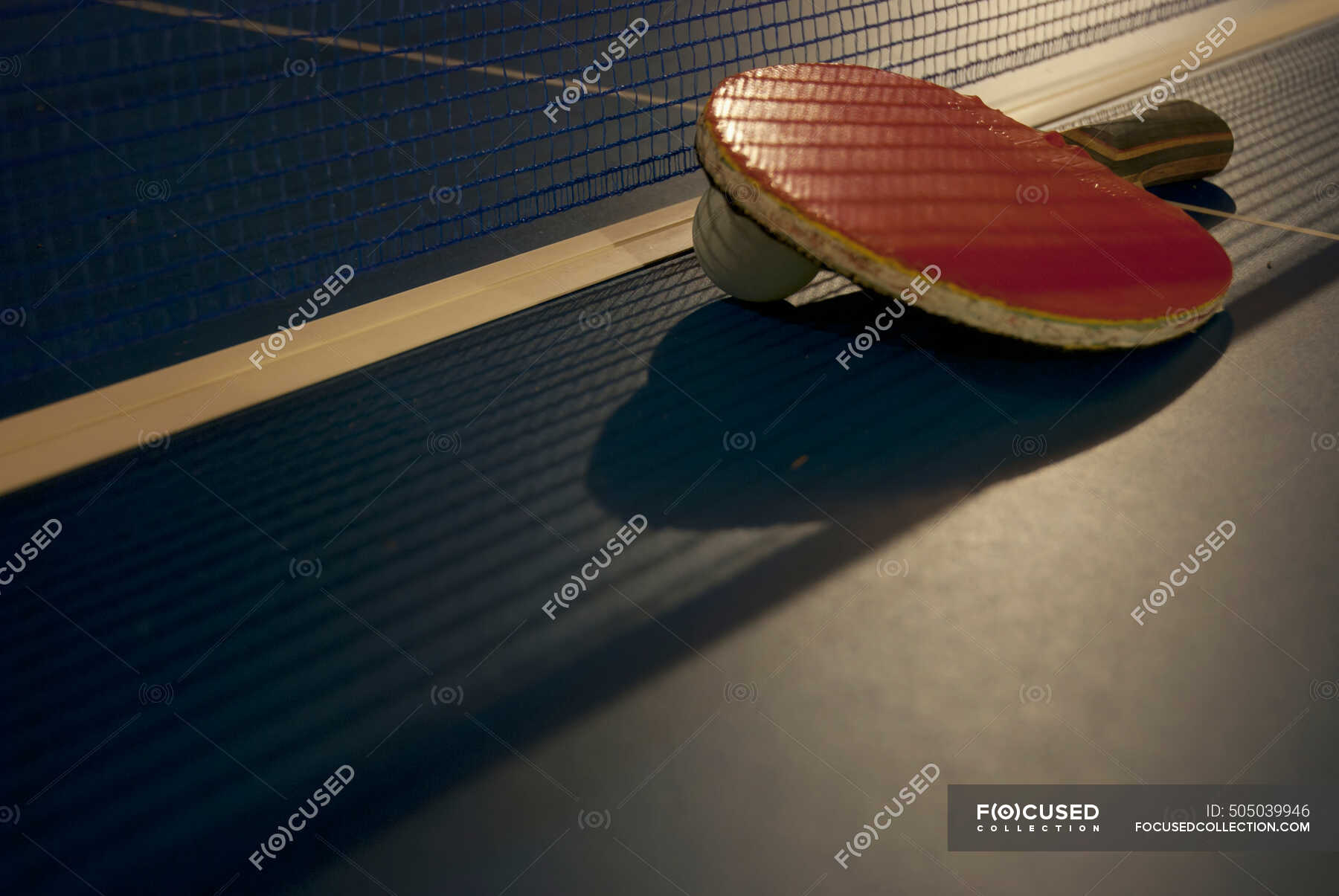 Ping Pong Paddle, Ball And Net On A Table; Tulum, Mexico — close up ...