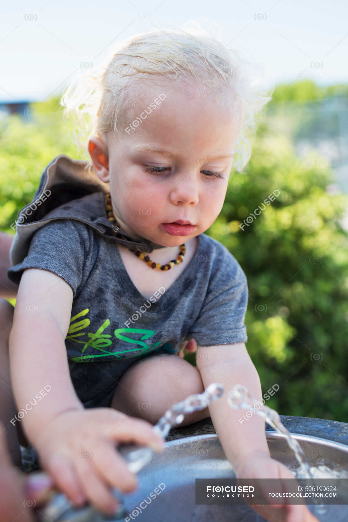 Young Boy At The Drinking Fountain On A Hot Summer Day; Toronto ...