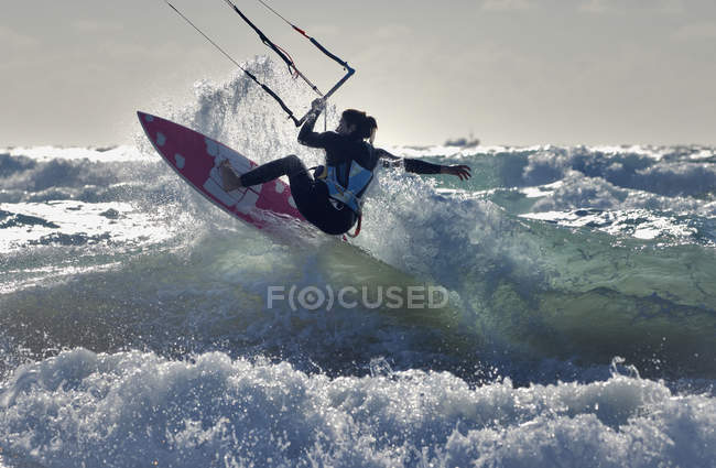 Adult extreme female athlet on kitesurfing board. Tarifa, Cadiz, Andalusia, Spain — Stock Photo