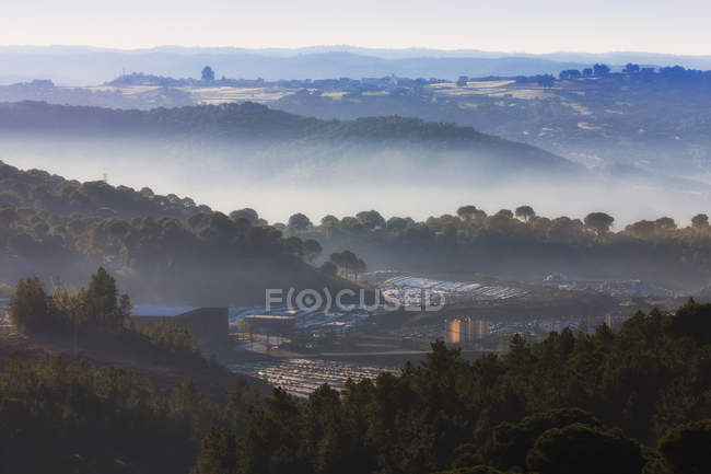 Countryside surrounded by hills — Stock Photo