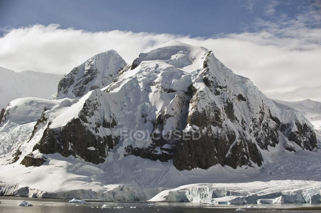 Rugged mountain covered with snow — Stock Photo