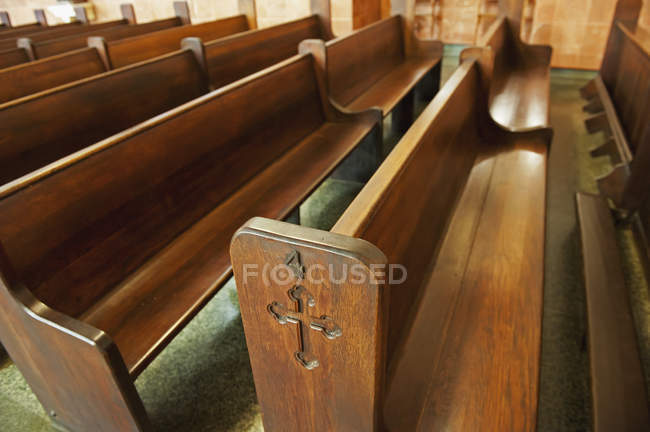 Wooden pews in church — Stock Photo