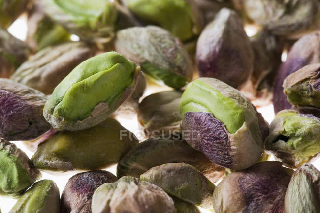 Closeup view of shelled pistachios heap — Stock Photo