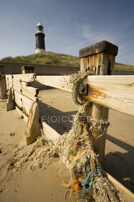 Fence And Lighthouse on hill — Stock Photo