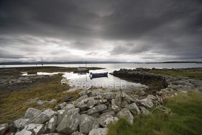 Boat In Water And Stormy Sky — Stock Photo